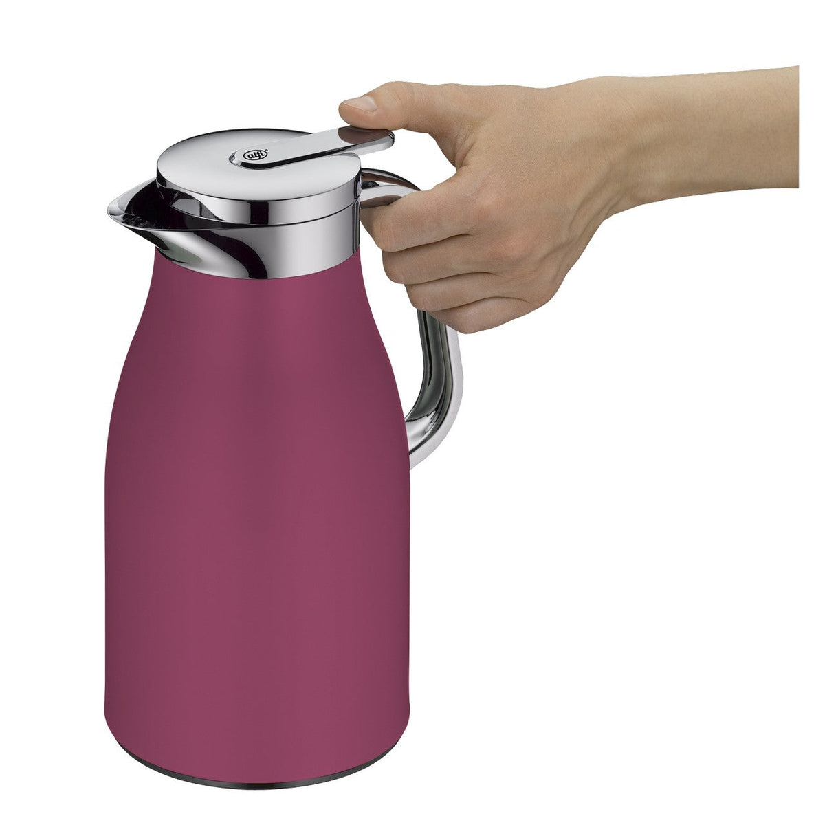 alfi Skyline thermoskan in deep rose naast bloemen en een kaars